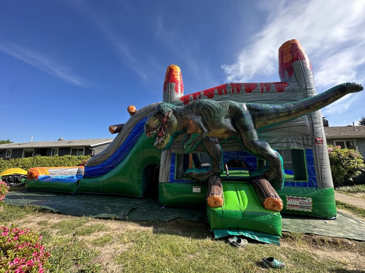 Giant Trex bounce house/waterslide 15’Wx14’Hx34’L